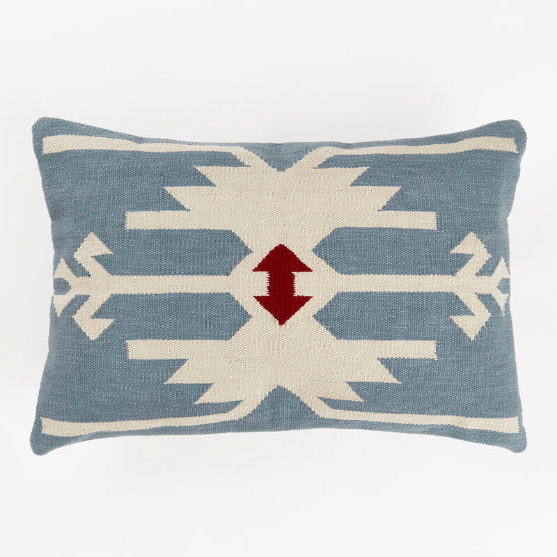 Decorative kilim inspired sofa cushion with geometric pattern. Mid blue background with cream design and deep red double arrow motif.
