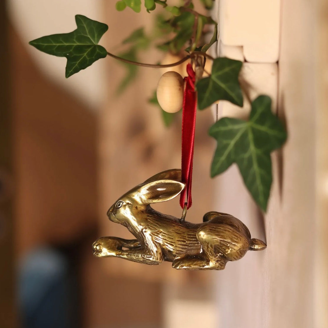 Brass hare-shaped hanging Christmas ornament.