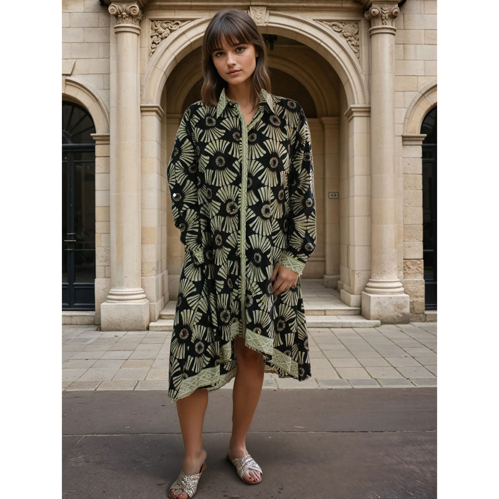 Patterned knee length shirt dress in black and gold.
