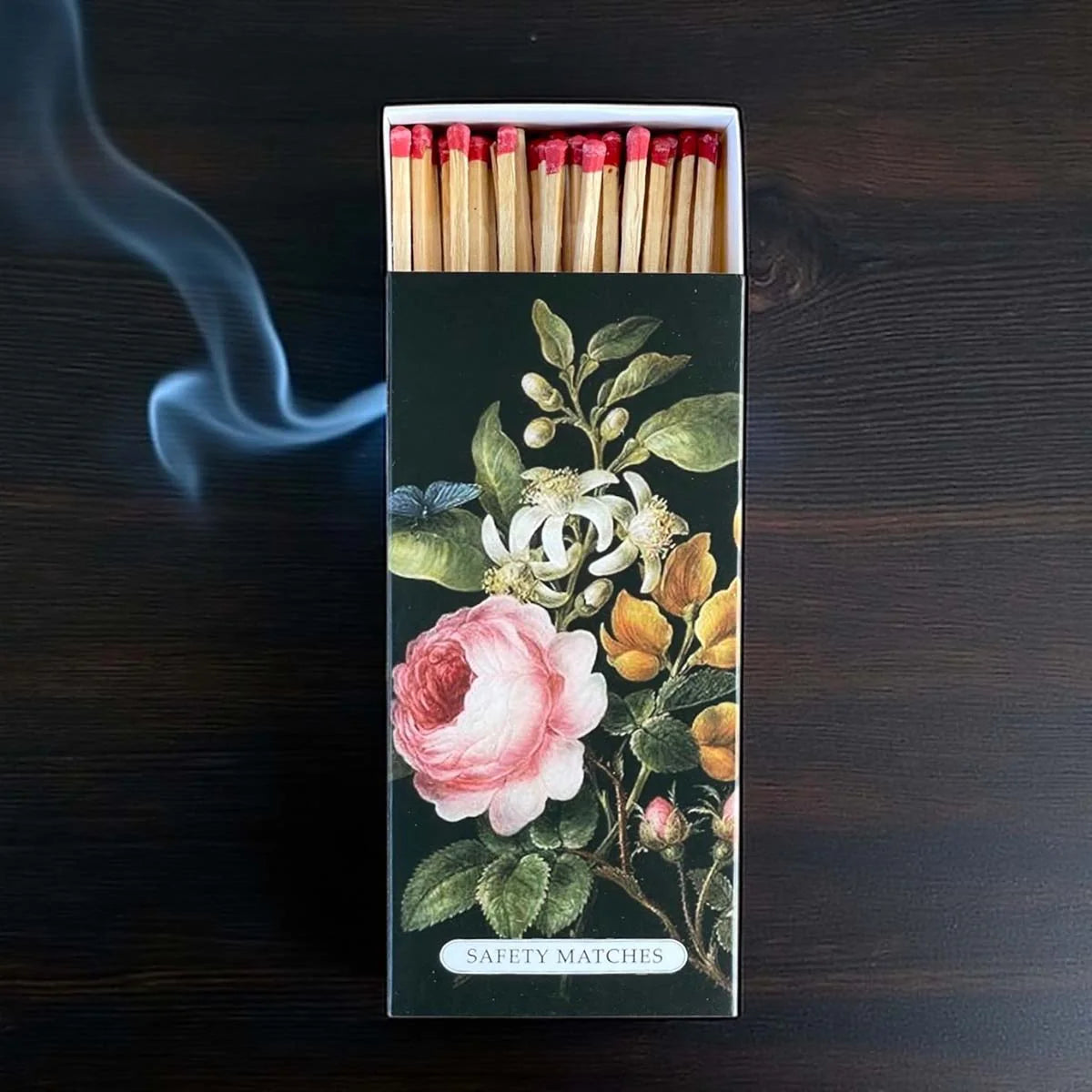 Matchbox with pink floral design.