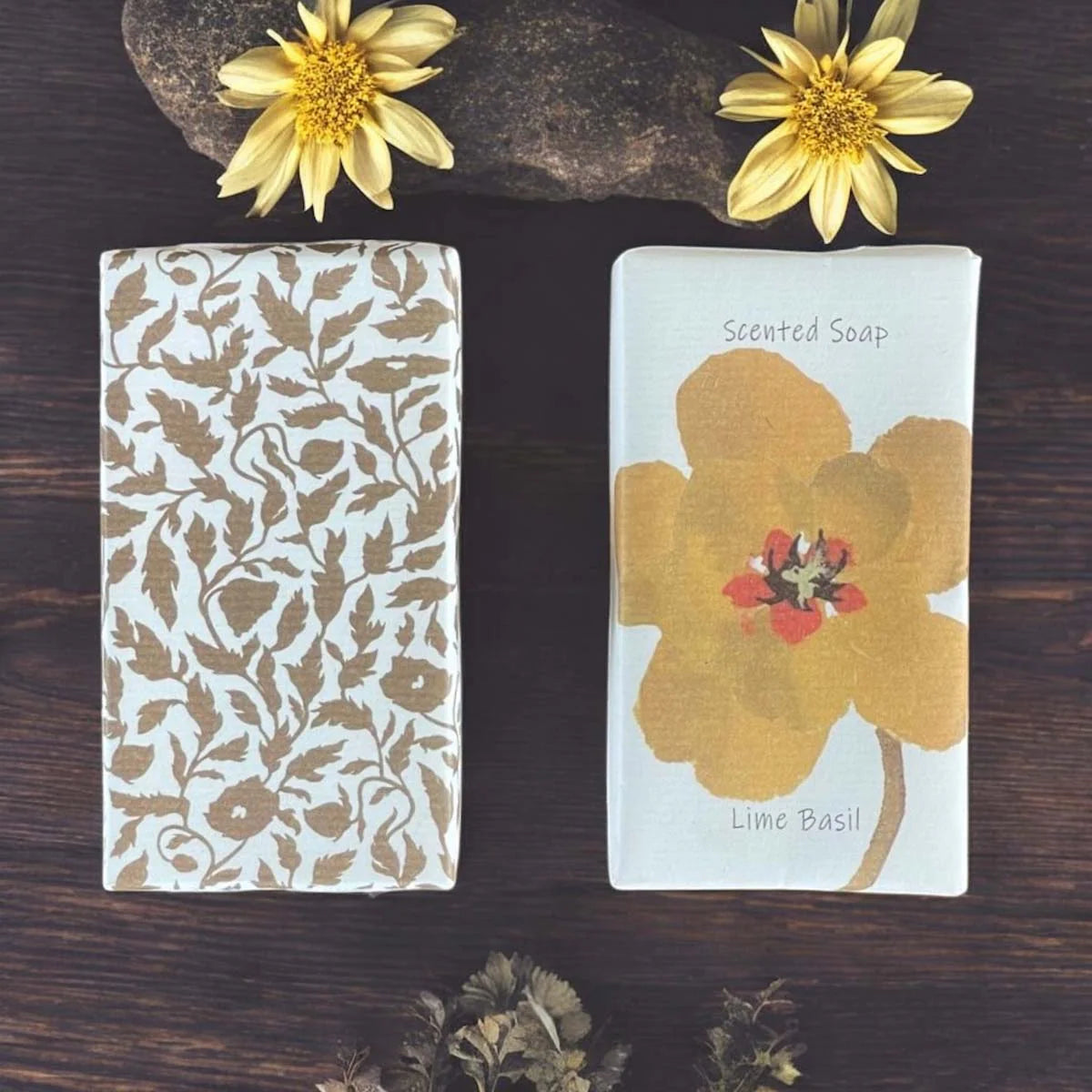 Two soaps with floral design wrappers.