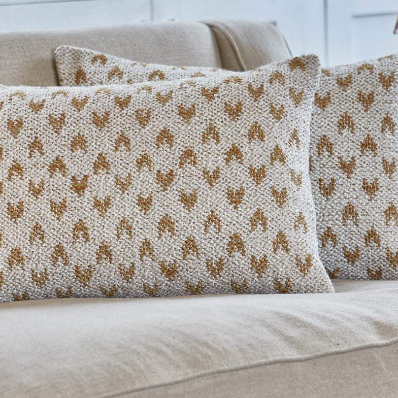 Mhari sofa cushion ecru with gold heart shaped motif