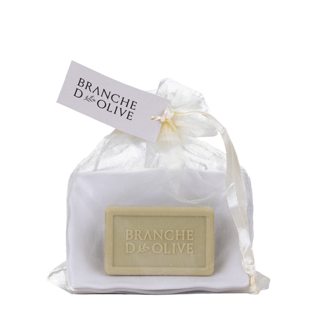 Bar of triple milled luxury Branche D'Olive soap and large draining soap dish in a voile bag with 'Branche d'Olive' branding on a white background