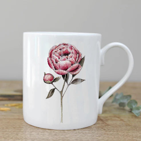 china mug with peony design on table top