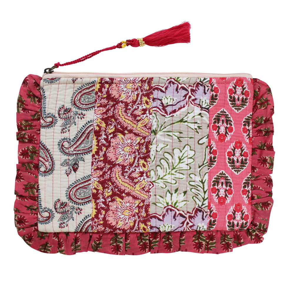 Patchwork makeup bag with pink floral and paisley print.