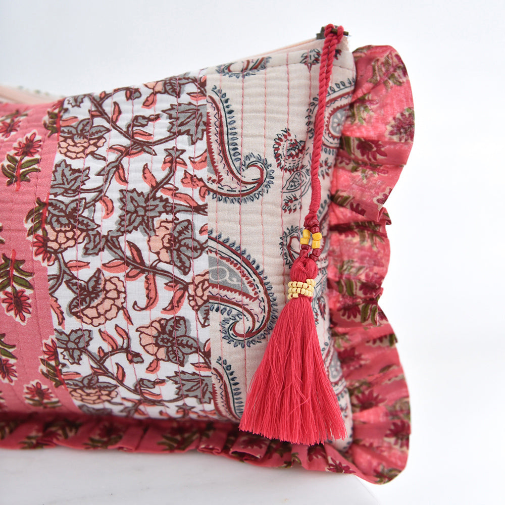 Patchwork makeup bag with pink floral and paisley print.