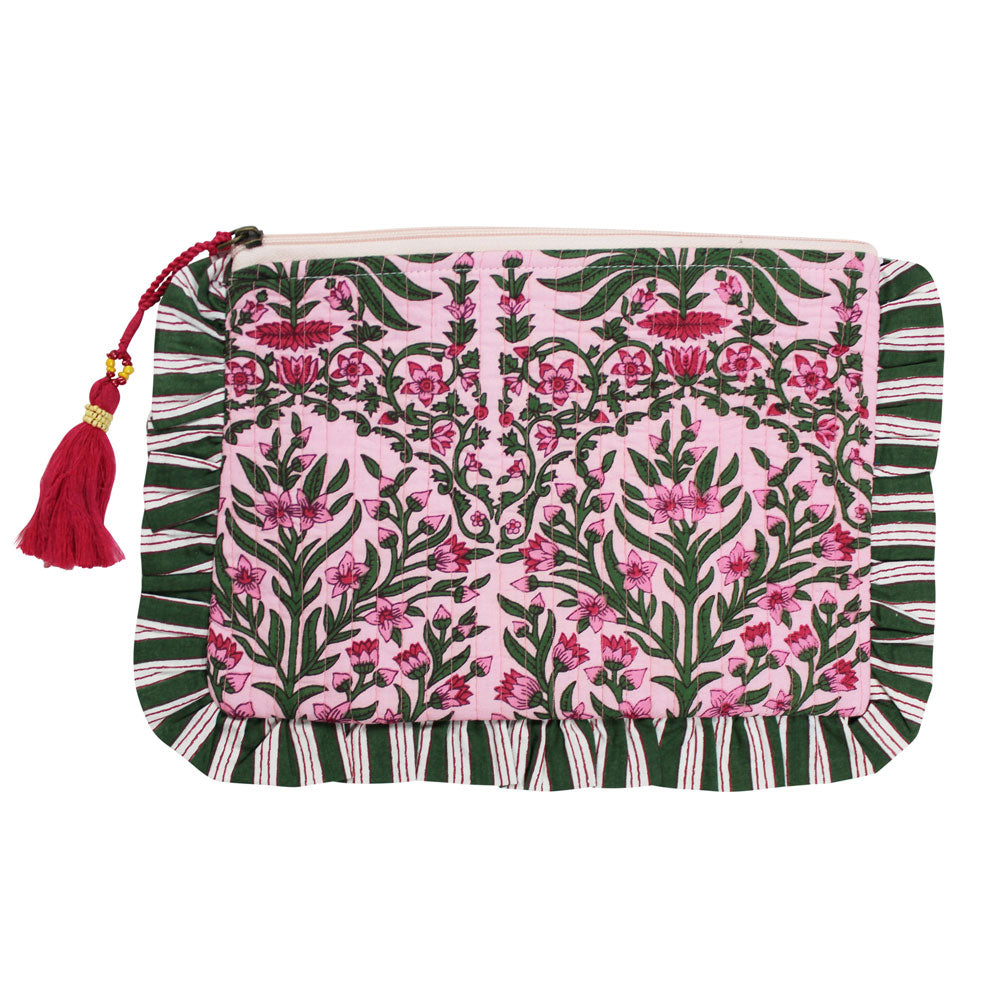 Back damask print make up bag with ruffle trim lifesstyele against white tiled background cut out