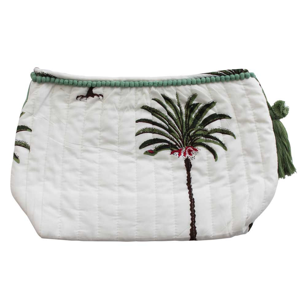 Palm tree print wash bag on white background with green pom pom trim cut out.