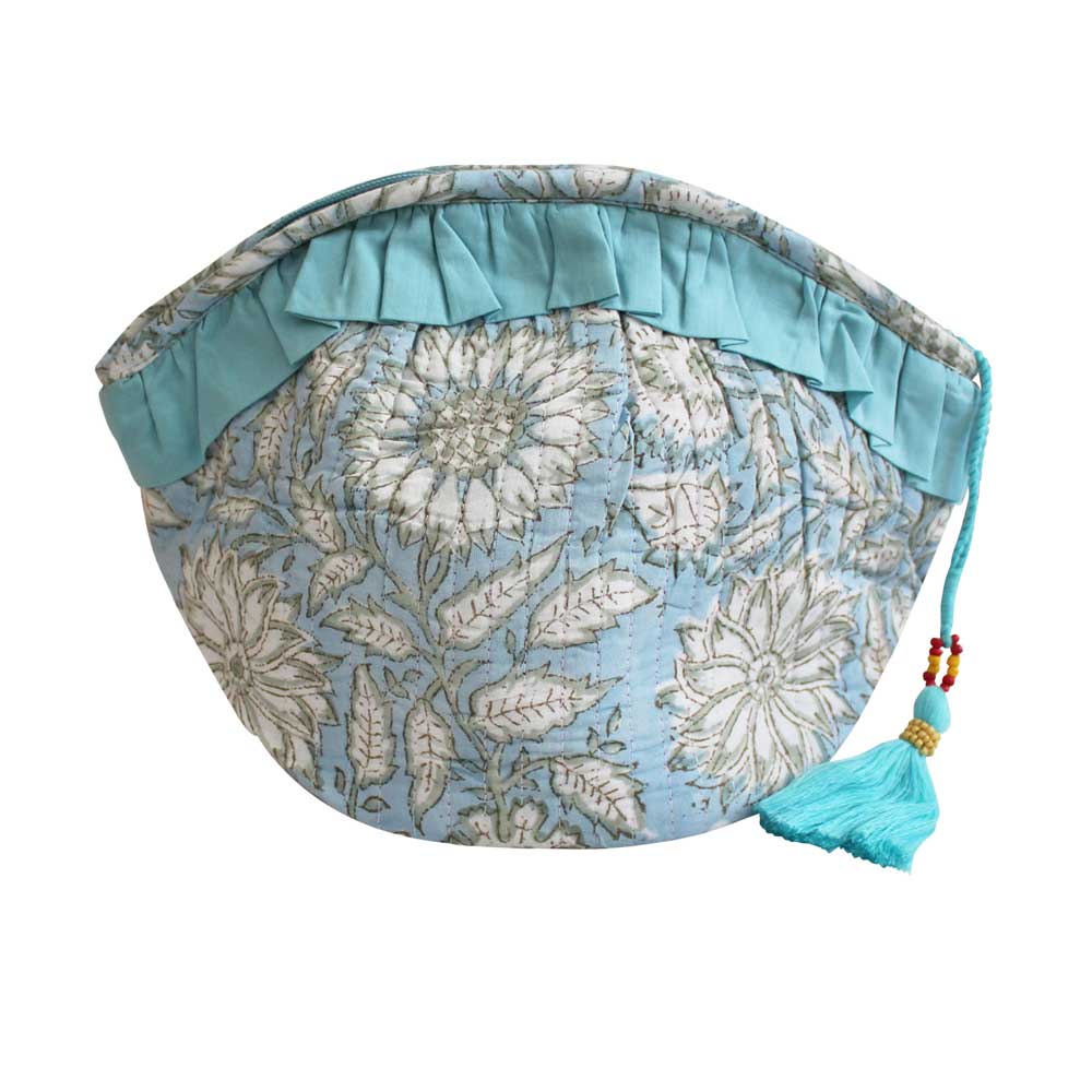 Cornflower blue wash bag with turquoise trim and tassel on a white background