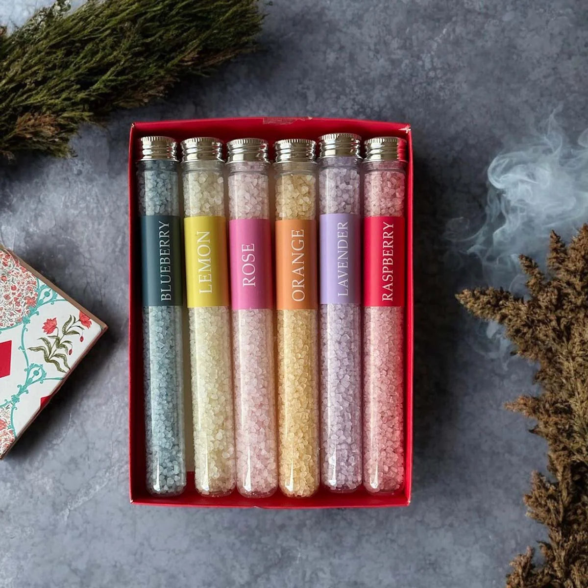 Set of six glass tubes with assorted scents.