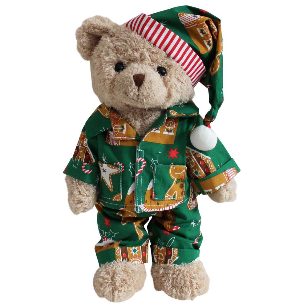 Teddy bear wearing gingerbread print green pyjamas.