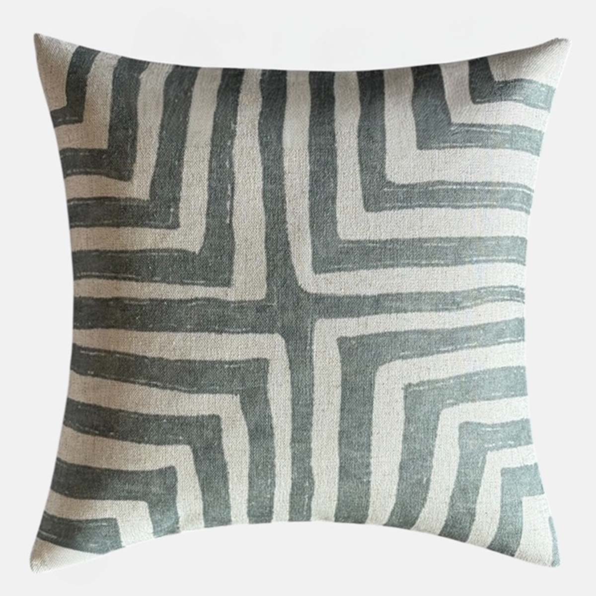 Decorative cushion with geometric leaf vein inspired pattern on a white background.