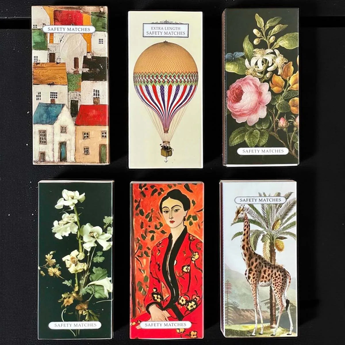 Collection of vintage matchboxes with vintage designs.