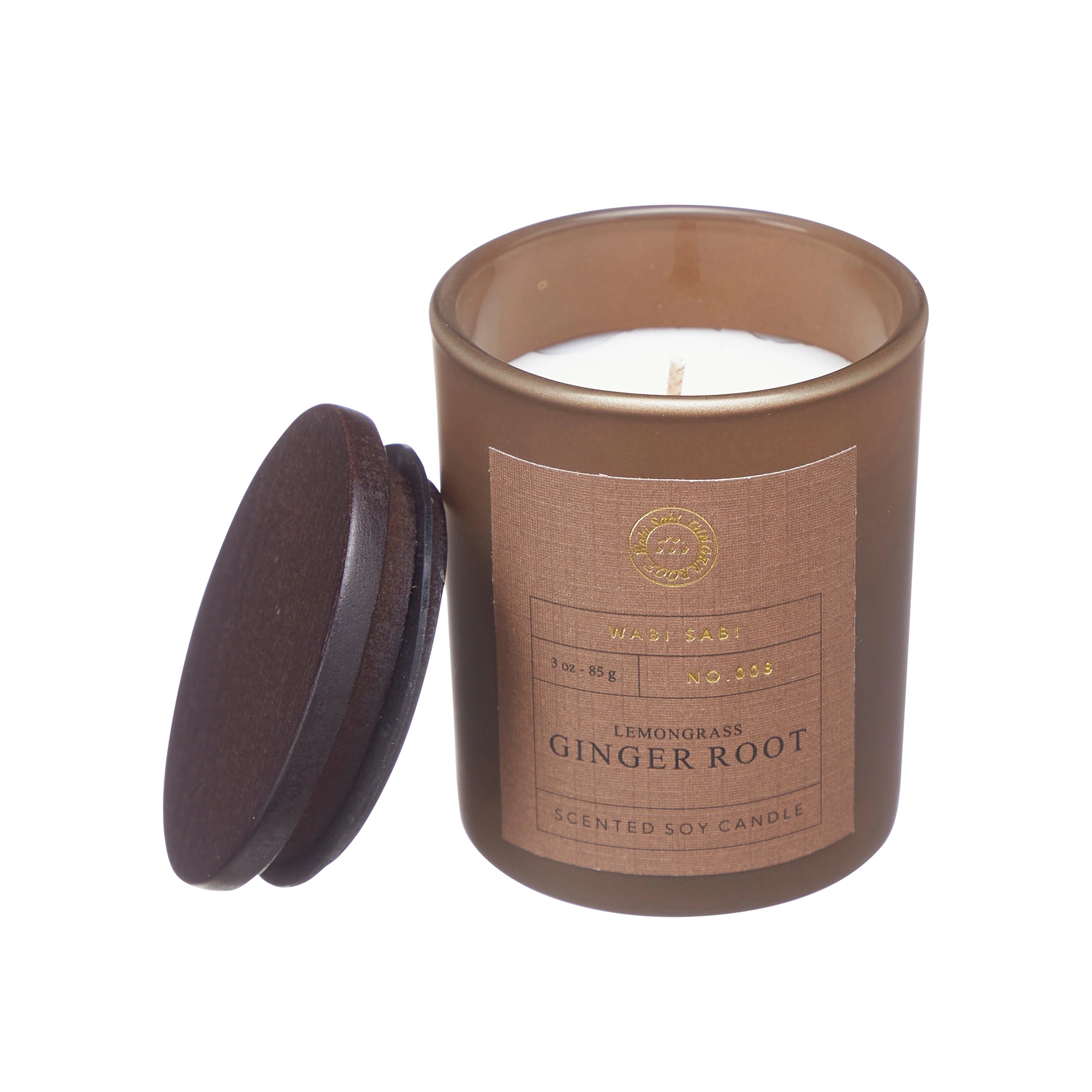 Candle in brown jar with 'Wabi Sabi Lemongrass Ginger Root' label.
