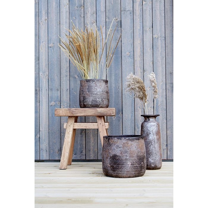 Wooden stool with decorative vases.