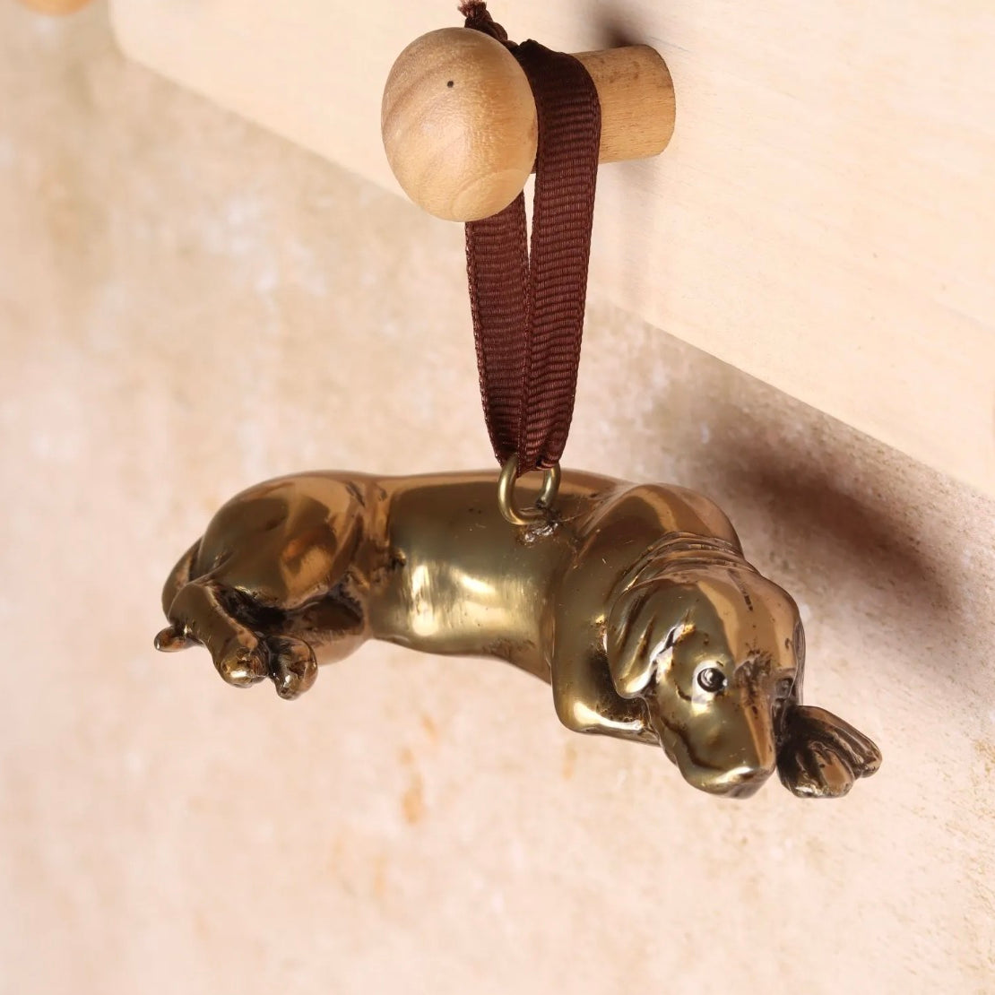 Brass Labrador shaped Christmas handing decoration.