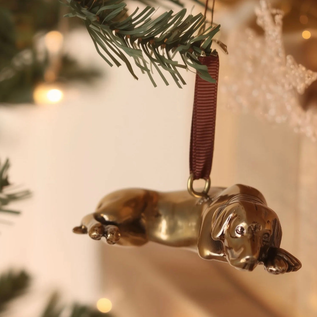Brass labrador shaped hanging ornament.