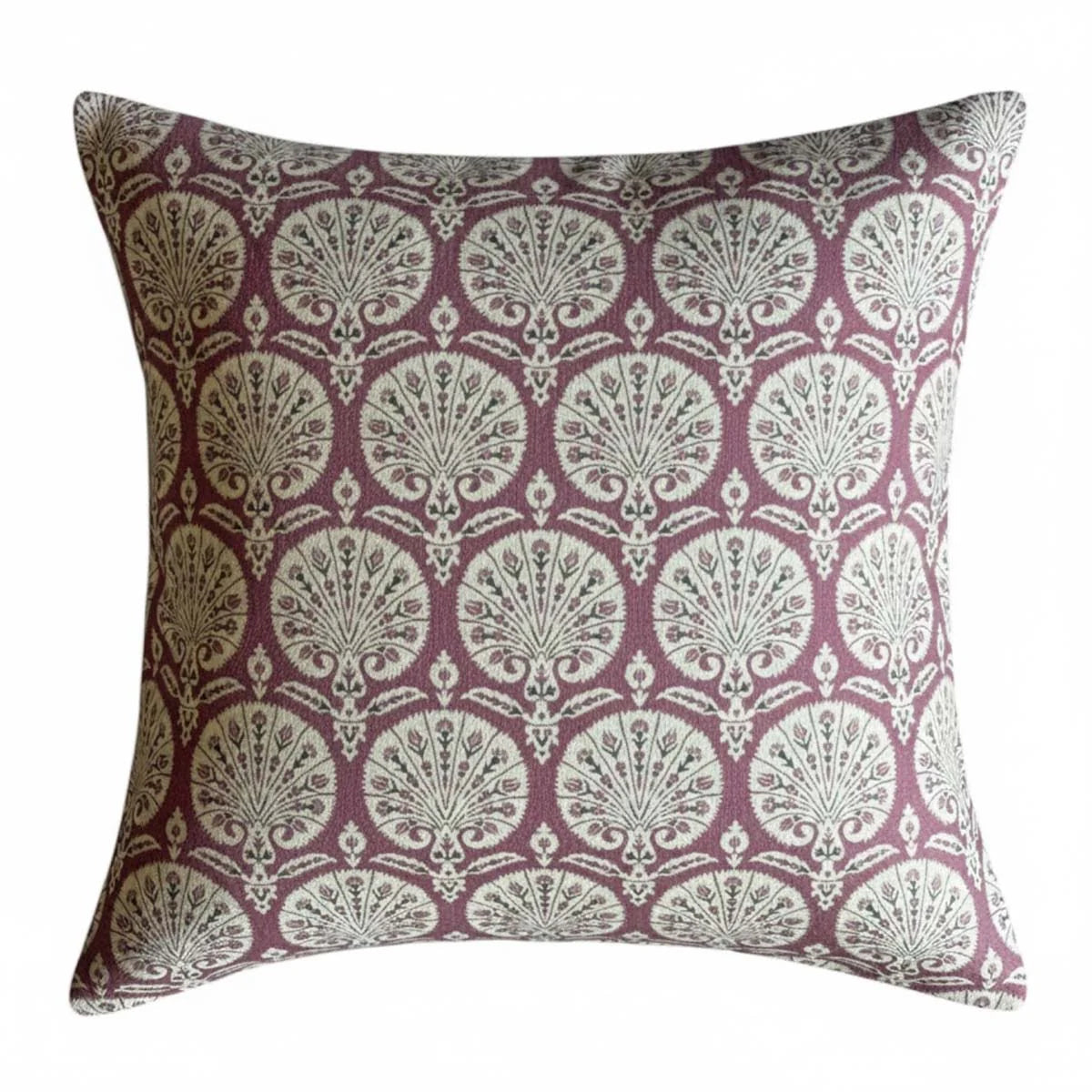 Decorative throw cushion with a grape and white patterned motif on a white background