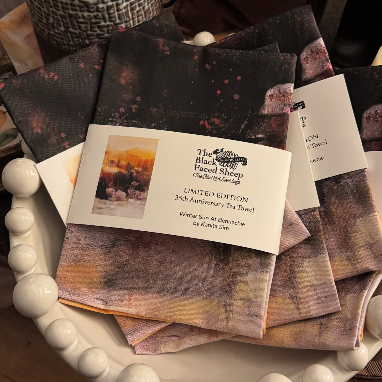 35th Anniversary Tea Towel with Aberdeenshire winter/autumn scenery with black faced sheep in the foreground.