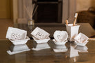 Set of double-layered, draining soap dishes with pretty geometric pattern cut into the top dish to provide drainage onto the bottom dish. 