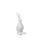 White ceramic hare figurine on a white background
