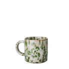 White mug with melange design in various shades of green.