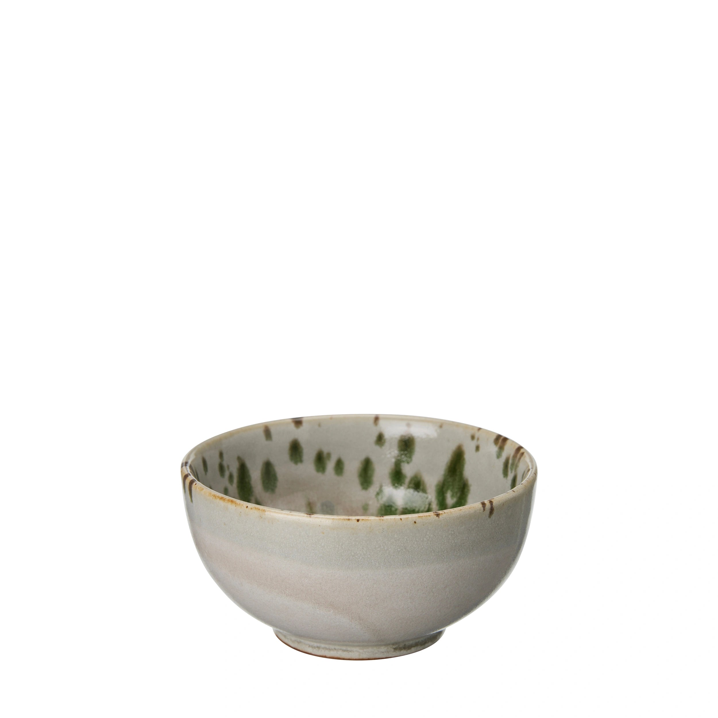 Aila porcelain bowl with speckled green design on an off-white background