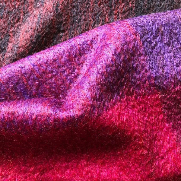 Detail of beautifully soft and luxurious traditionally crafted Mohair Throw in Berry Colours, pink, purple and mauve.
