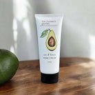 Hand cream tube with avocado illustration scented with avocado and lemon.