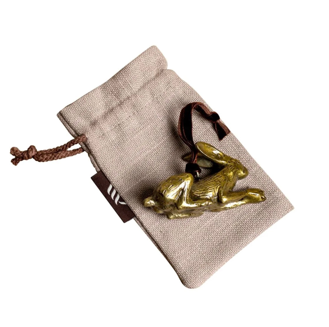 Brass hare-shaped hanging Christmas decoration on linen gift bag.