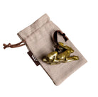 Brass hare-shaped hanging Christmas decoration on linen gift bag.