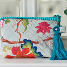Blue floral print makeup bag with blue tassel.