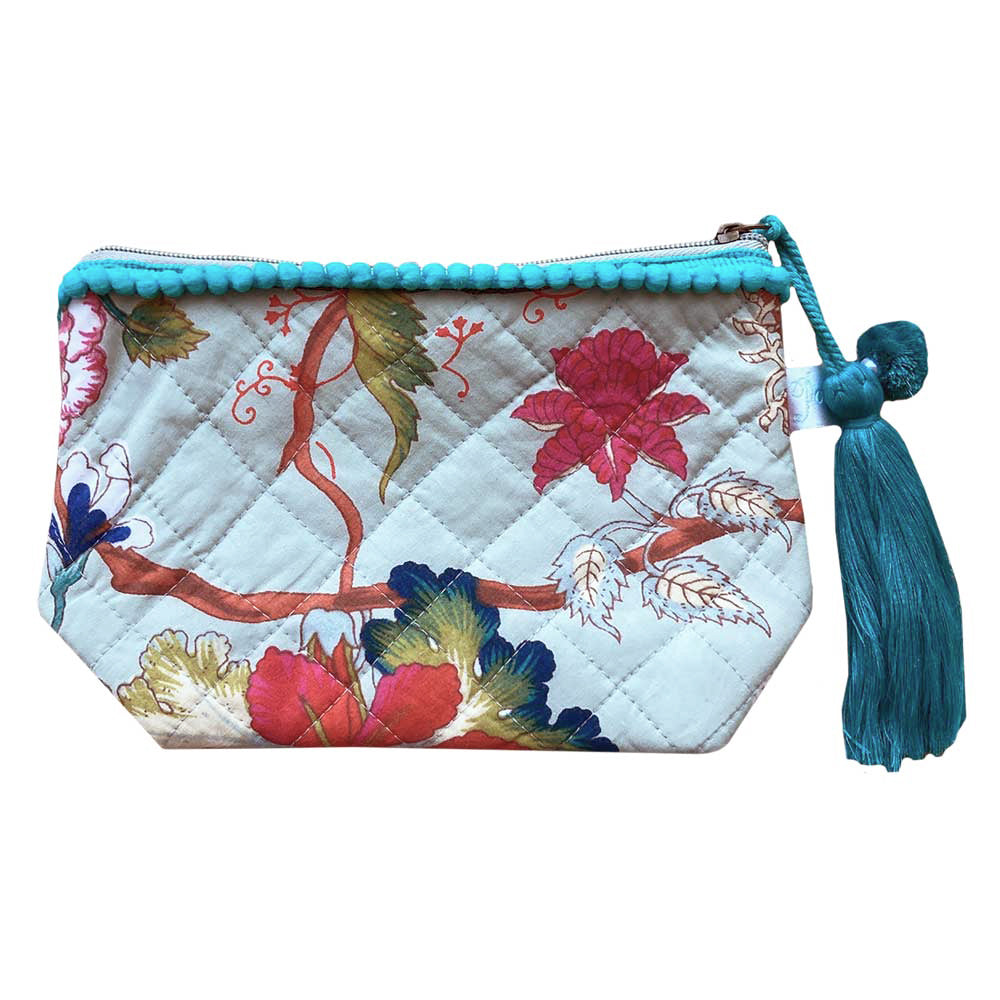Blue floral print makeup bag with blue tassel.