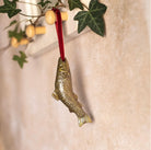 Brass fish-shaped hanging Christmas decoration.