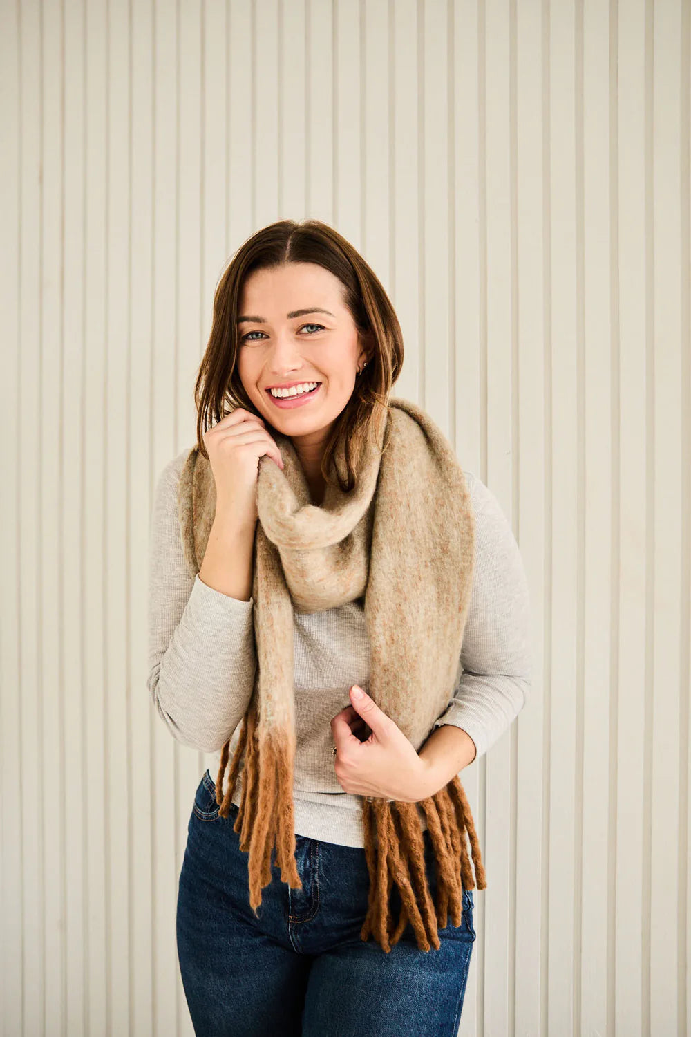 Camel tonal winter scarf with brown tassels.