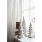 White ceramic Christmas tree decoration.