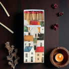 Matchbox with colourful house design.