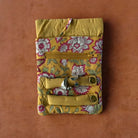 Yellow floral fabric jewellery roll.