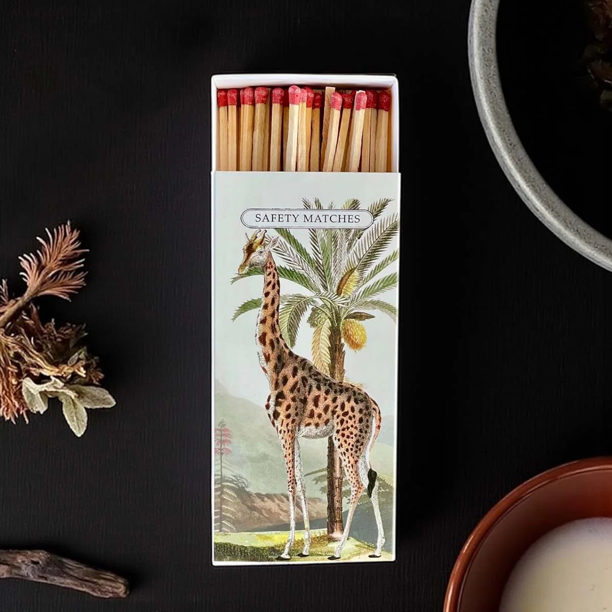 Matchbox with giraffe design.