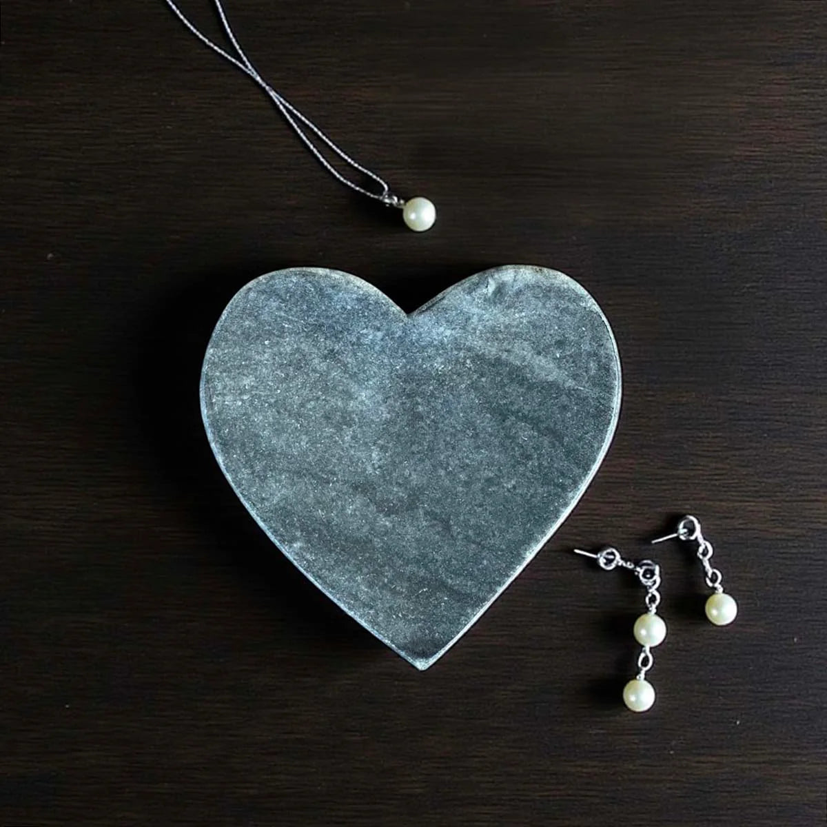 Grey heart-shaped marble plate.