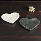 Two heart-shaped marble plates.