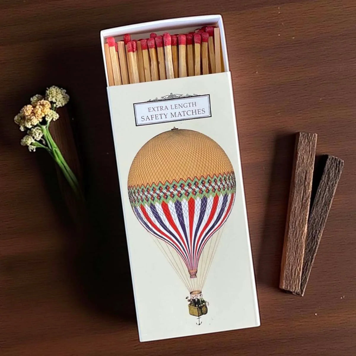 Matchbox with hot air balloon design.