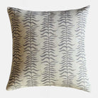 Decorative throw cushion with leafy stripe pattern on a white background.