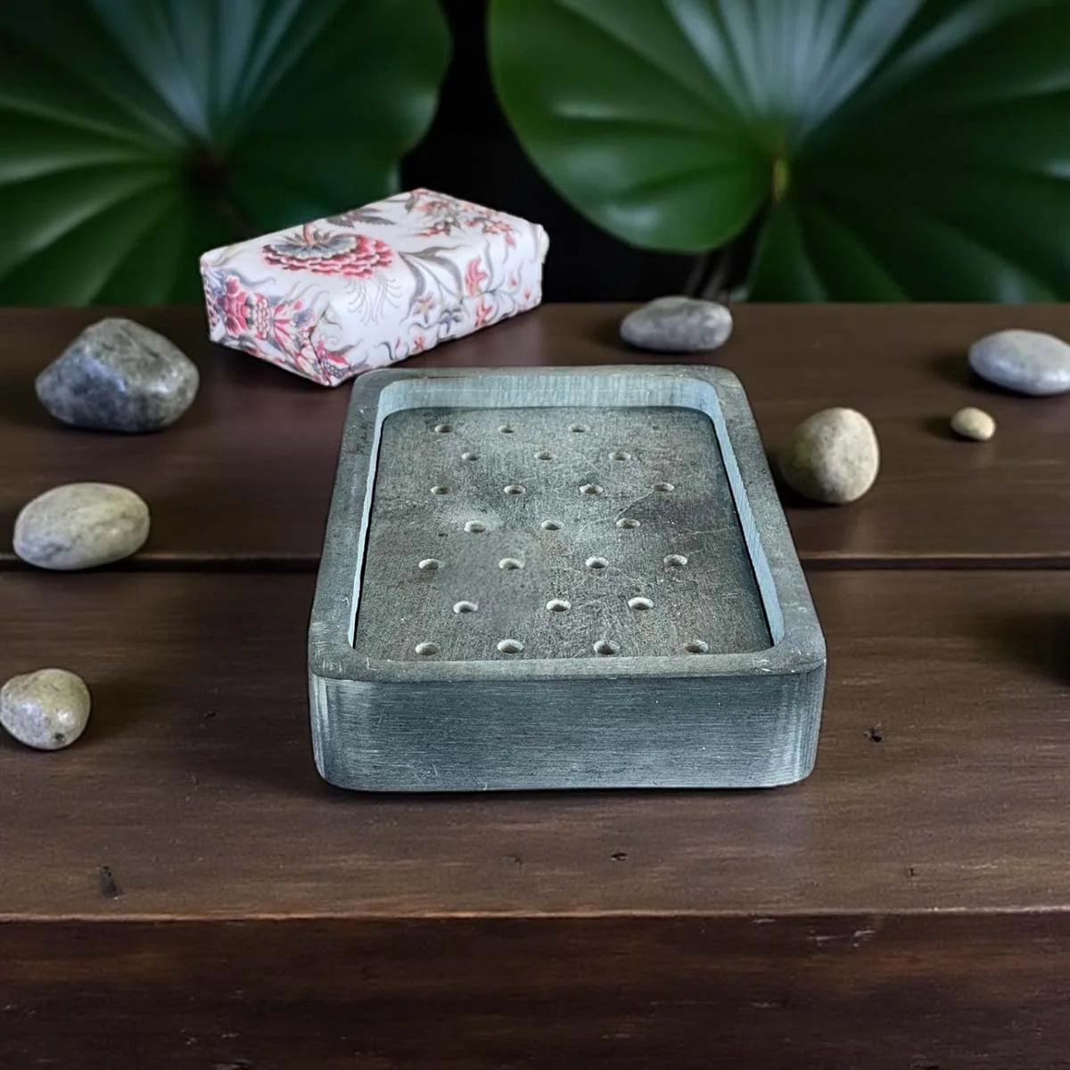 Rectangular grey marble soap dish.
