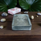 Rectangular grey marble soap dish.