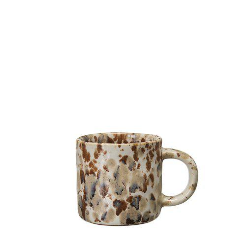 White mug with melange decoration in a variety of browns.