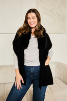 Black scarf with fur trim.