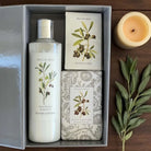 Gift set with hand lotion, soap, and scented sachets.