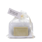 Bar of triple milled luxury Branche D'Olive soap and large draining soap dish in a voile bag with 'Branche d'Olive' branding on a white background