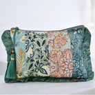 Green patchwork print wash bag with green tassel.